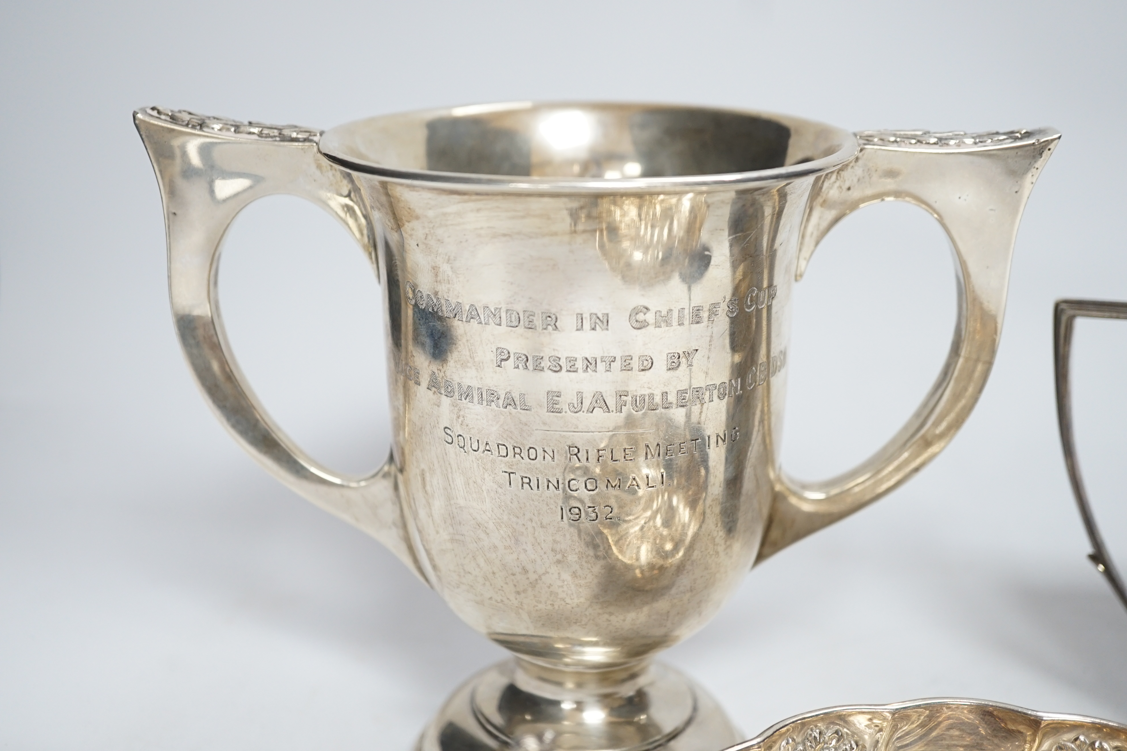 A George III engraved silver helmet shaped cream jug, John Eames, London, 1798, 11.1cm, a Japanese Suzuyo 950 white metal two handled shallow bowl, a George V silver two handled presentation trophy cup and a silver circu